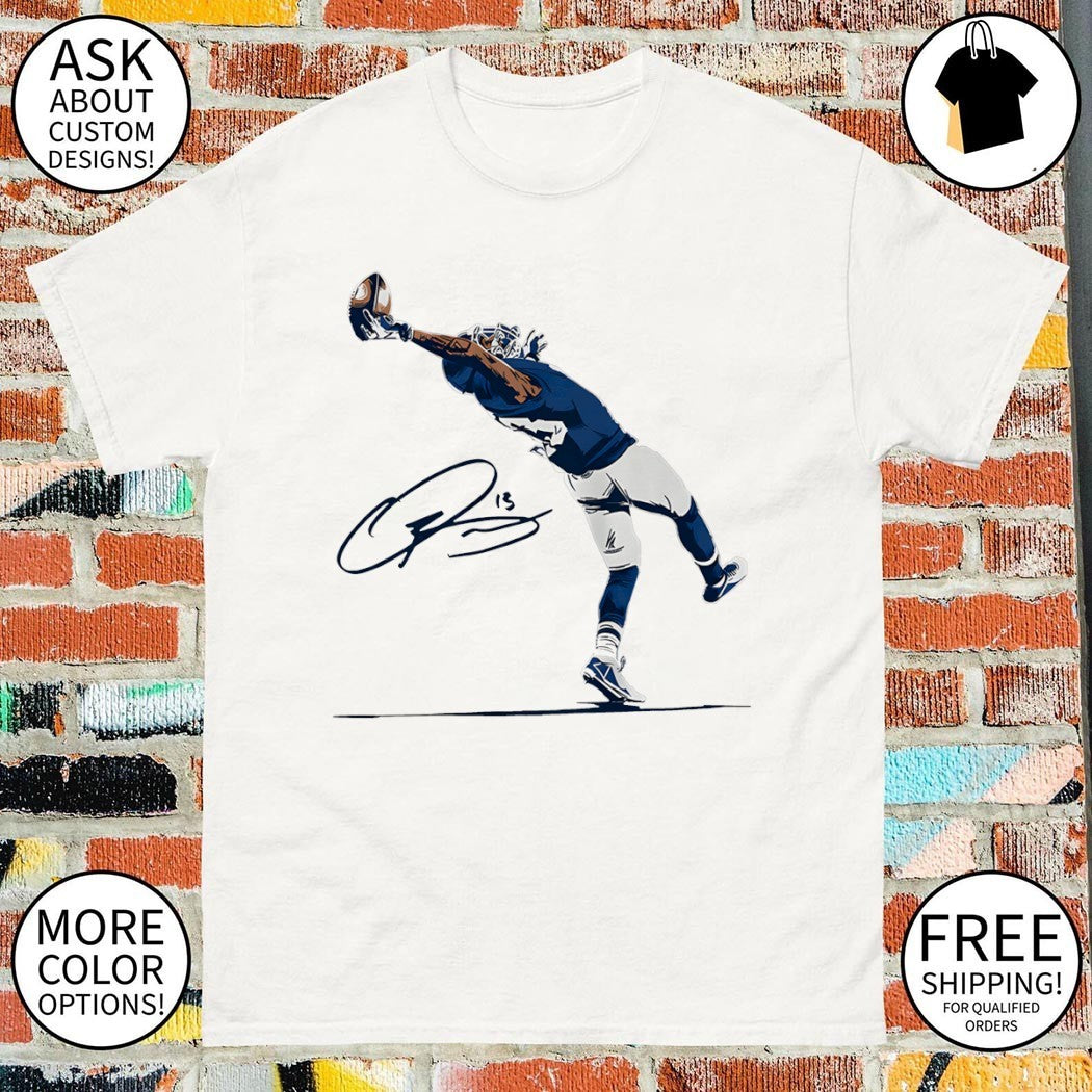 Odell Beckham Jr. catching a football with his number 13 autograph shirt