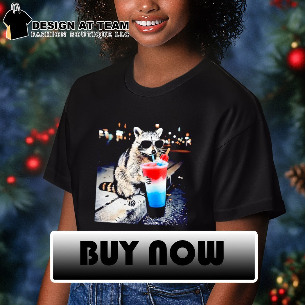 Raccoon holding a red white and blue slushy with popsicle shirt