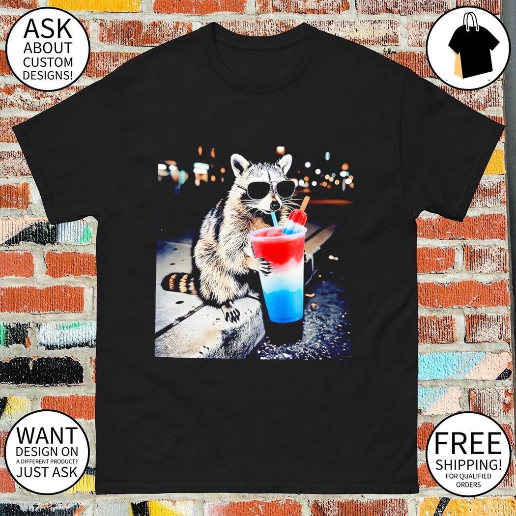 Raccoon holding a red white and blue slushy with popsicle shirt