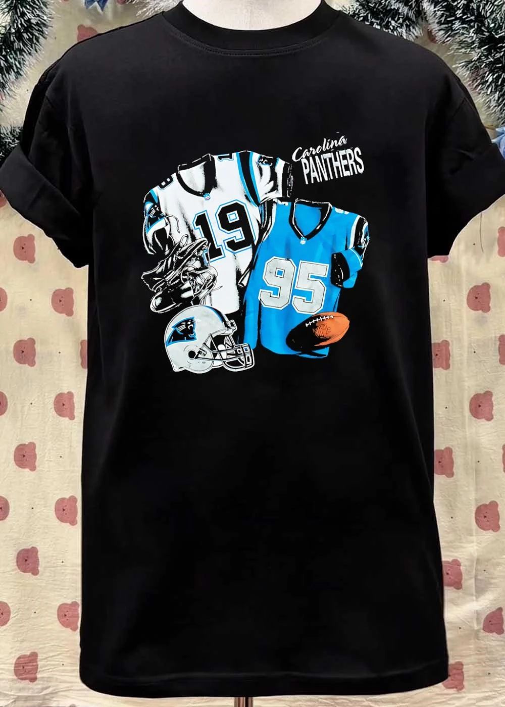 Nutmeg Carolina Panthers Featuring Numbered Jerseys and Helmet Shirt