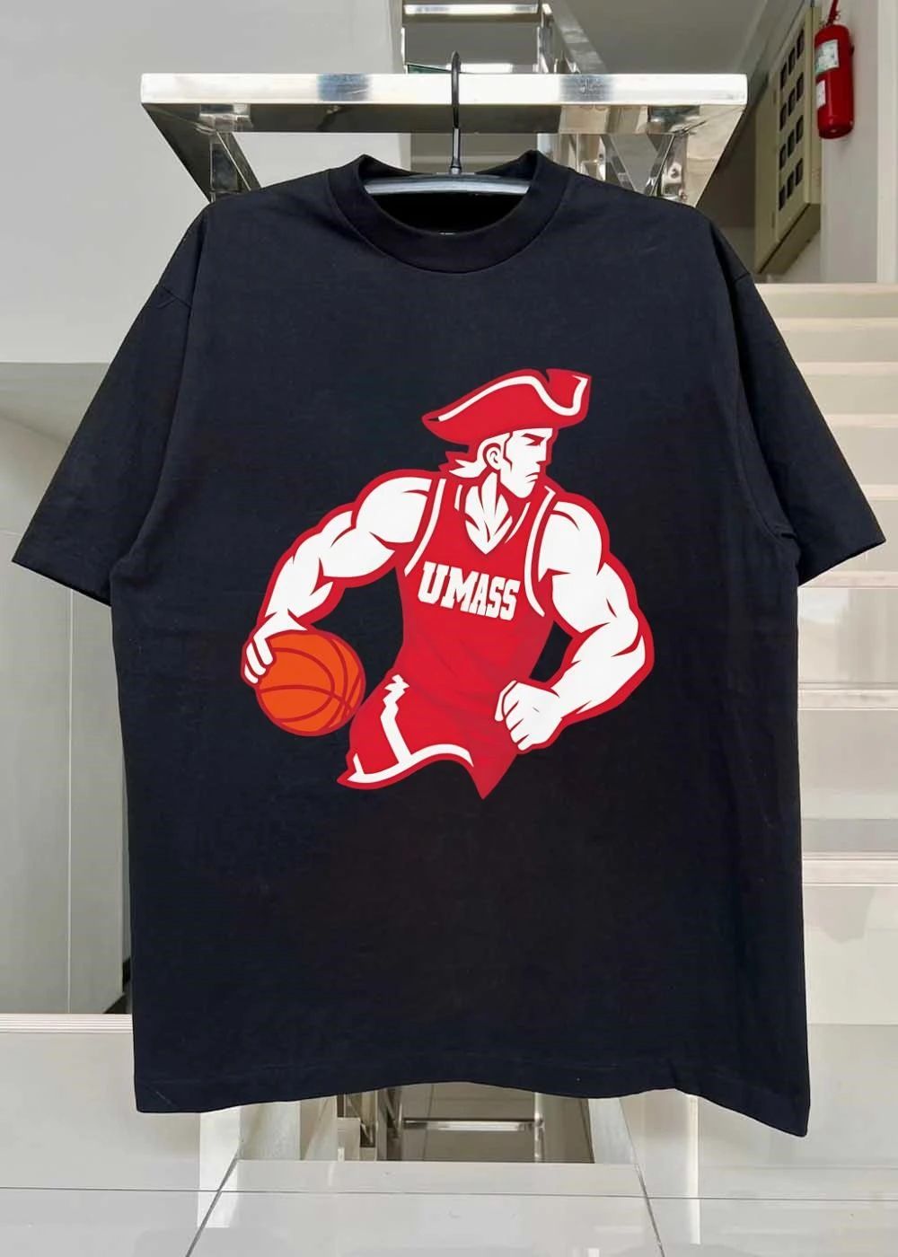 Minuteman Dribbling Ball UMass shirt