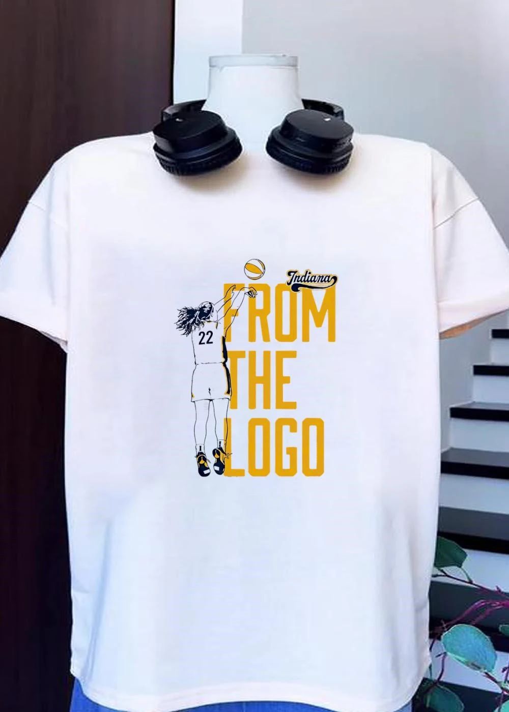 Indiana Basketball Player Jumping for Shot From the Logo Shirt