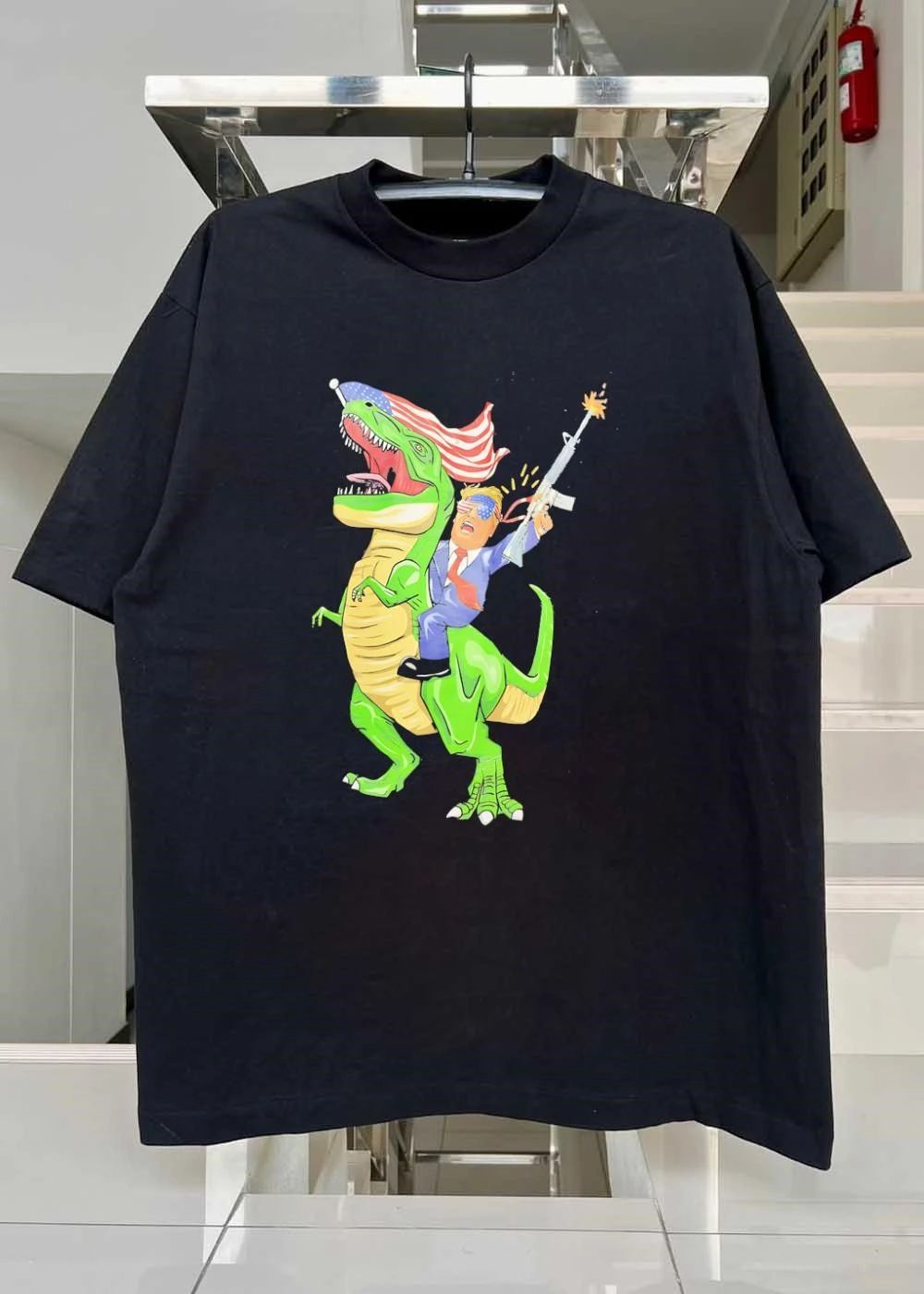 Patriotic Apparel Donald Trump Riding T-Rex Firing Rifle shirt