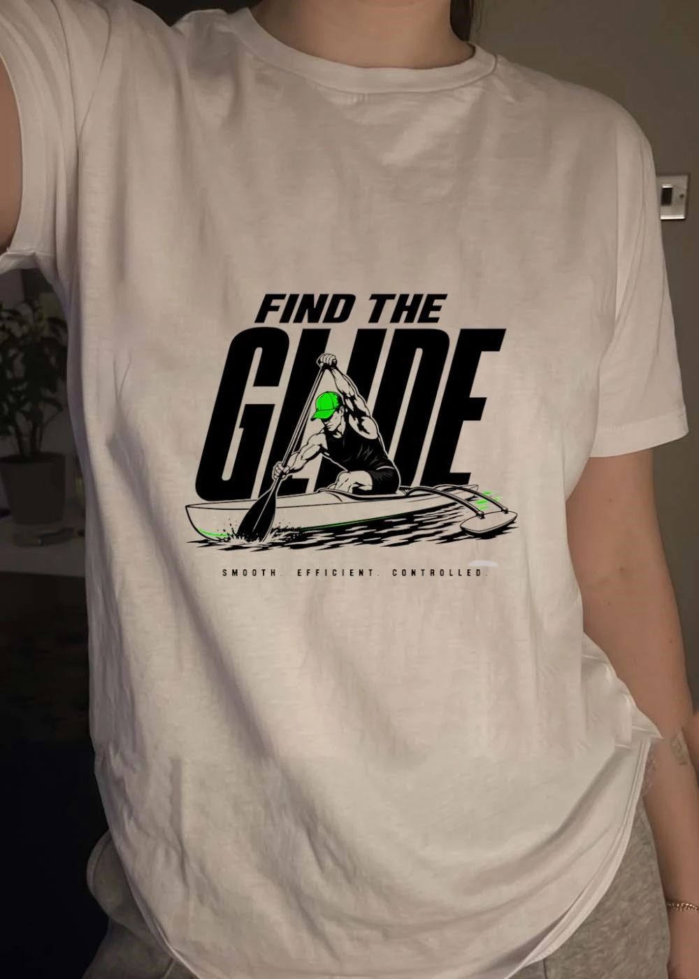Find the Glide Outrigger Canoe Paddler Green Cap Smooth Efficient Controlled Road to 2026 Watersports Shirt