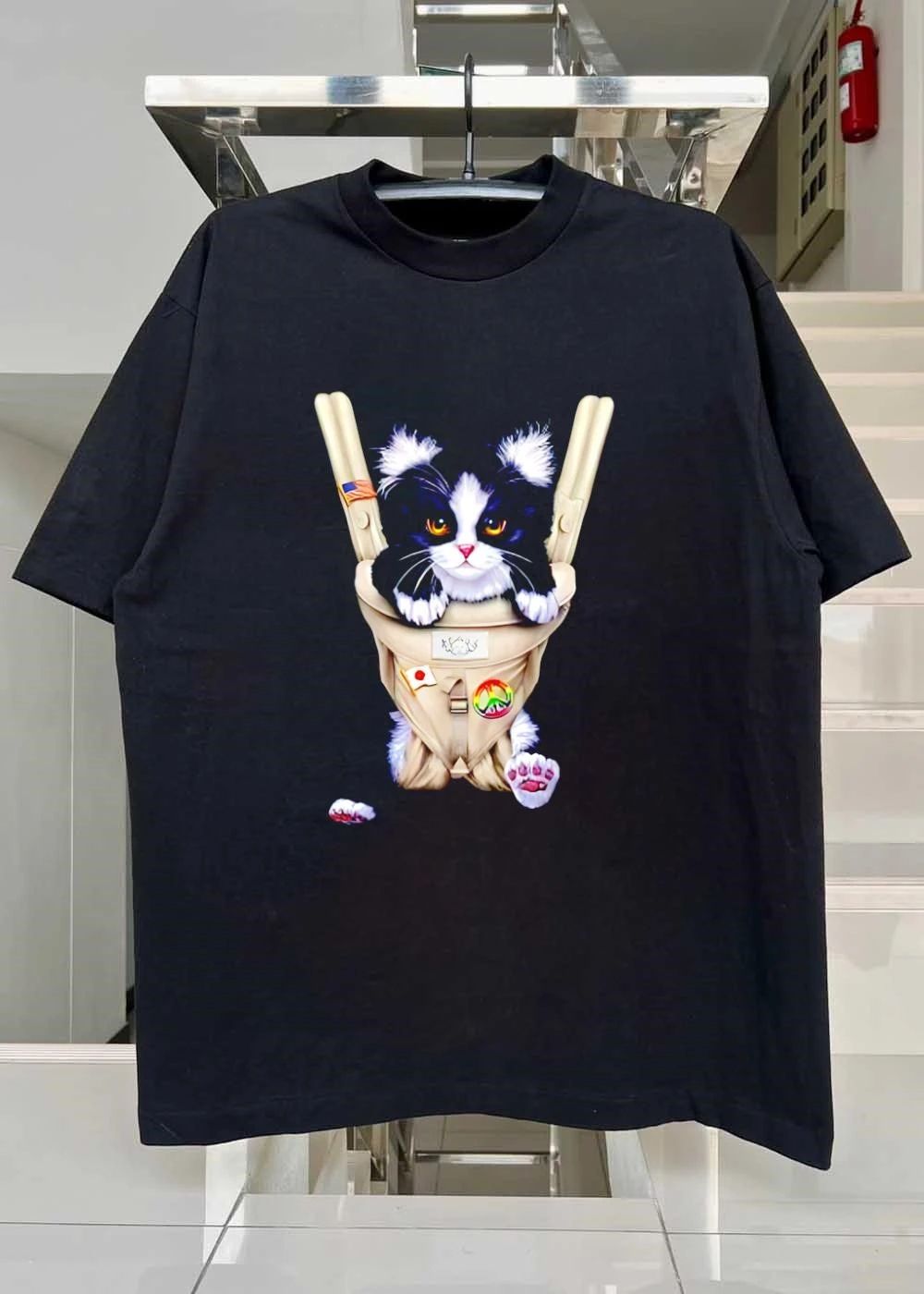 Cute Tuxedo Cat in Baby Carrier with Flag and Peace Sign T-Shirt