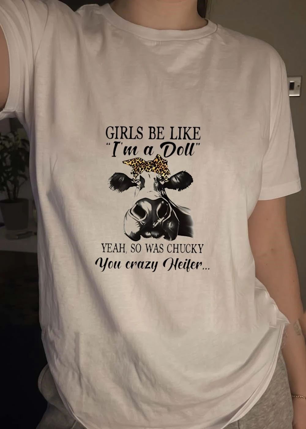 Cow girls be like I’m a doll yeah so was chucky you crazy heifer shirt